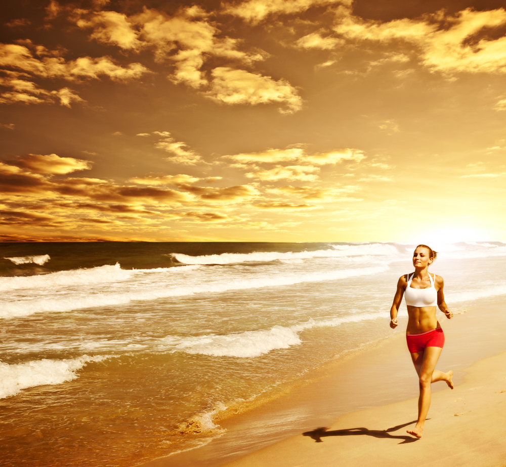 Healthy woman running on the beach