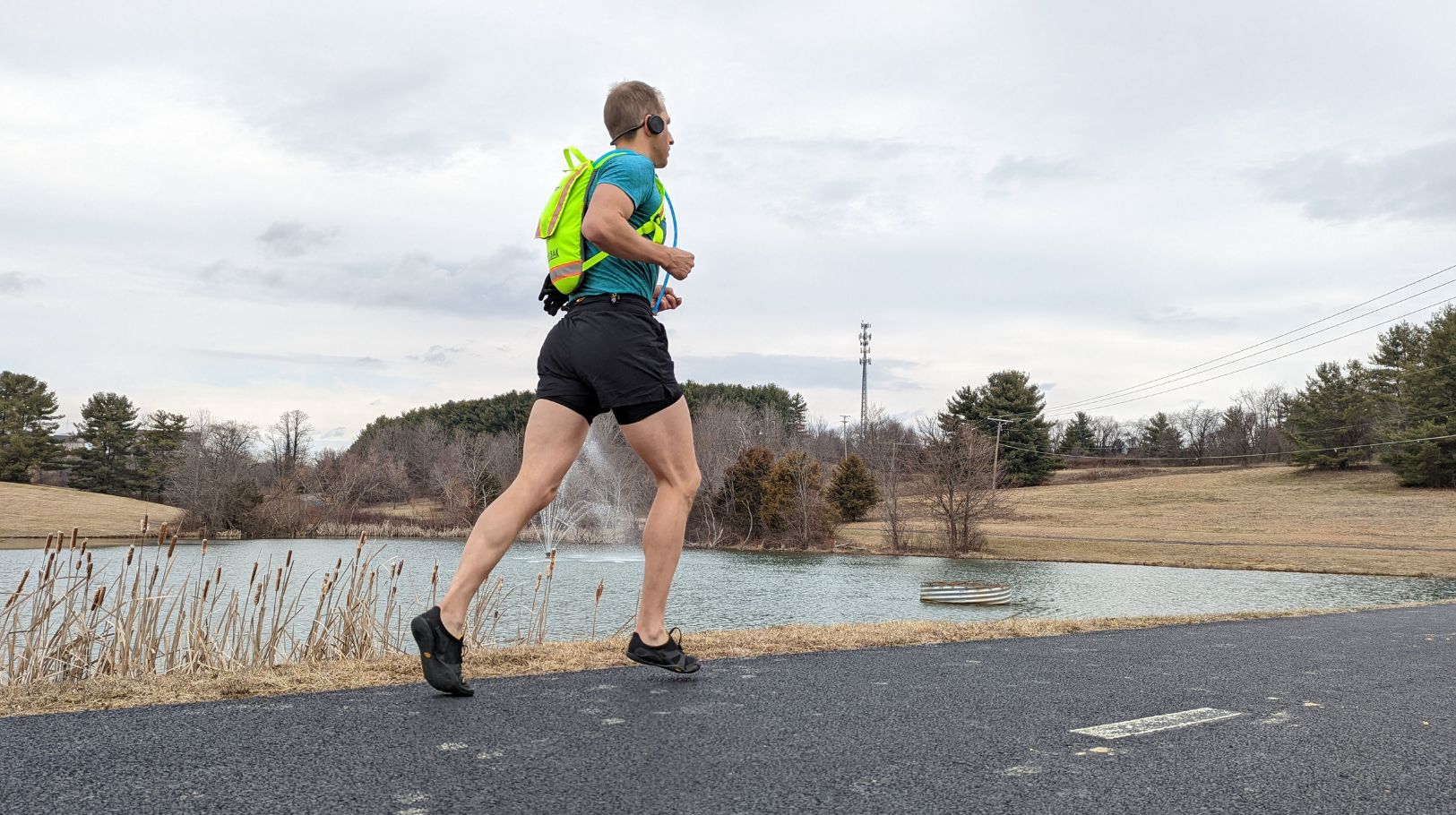 Runner pushing off during stride to illustrate Achilles tendon loading in Charlotte